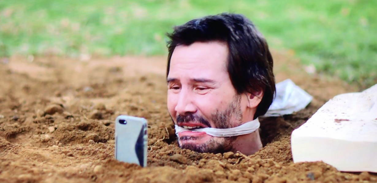 keanu reeves usando iphone